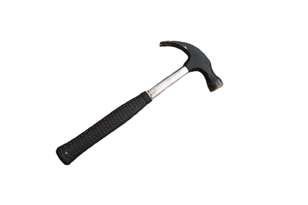 A studio photograph of a claw hammer isolated on a transparent background. The hammer is positioned diagonally, with the handle extending toward the bottom left corner and the metal head pointing toward the upper right corner. It features a black steel head with a smooth striking face on one side and a curved claw on the opposite side for pulling nails. The handle has a silver metallic shaft covered by a long black rubber grip with a textured dotted pattern for improved comfort and slip resistance. The end of the grip slightly flares outward, giving the hammer a balanced and ergonomic design commonly used for driving and removing nails.