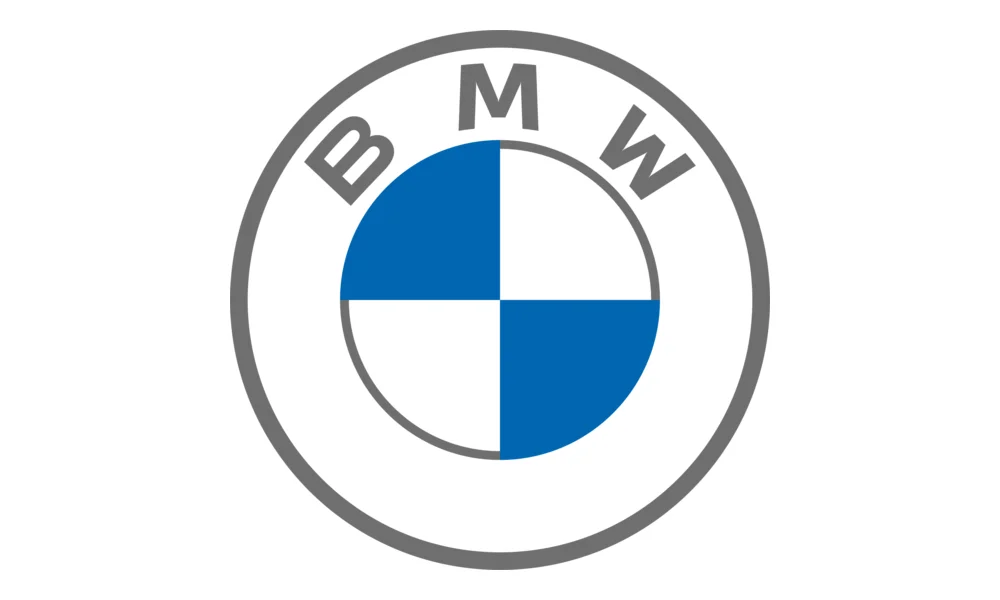 A BMW car logo displayed prominently against a plain white background. The emblem features BMW’s circular design with a gray outer ring, the gray “BMW” lettering along the top, and a blue-and-white quartered center pattern. The image represents The image represents BMW as one of the automotive brands covered by Quickey Locksmith Services.