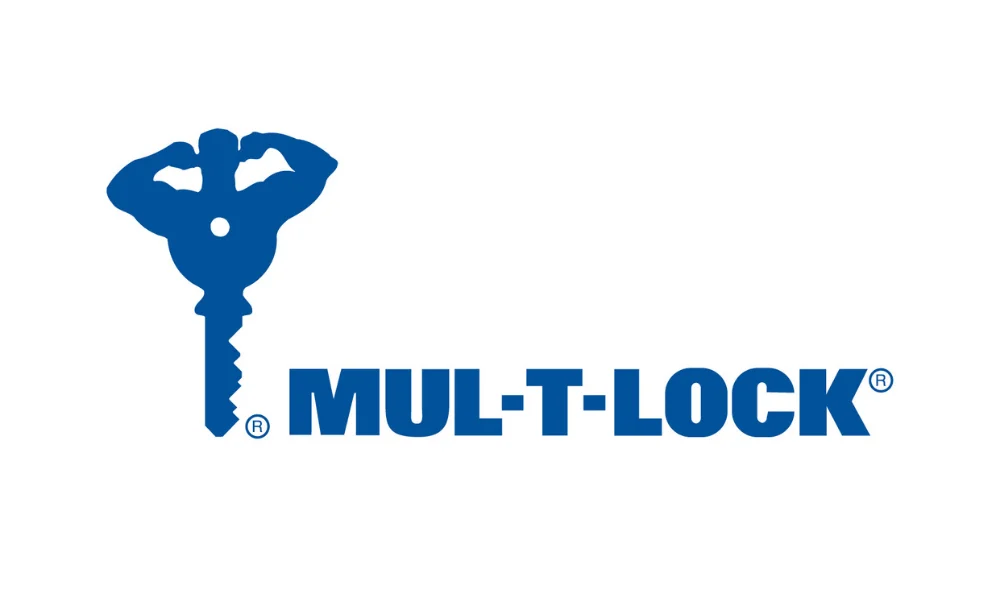 Mul-T-Lock logo featuring a stylized blue key with a human-like figure forming the key’s bow, positioned to the left of the brand name “MUL-T-LOCK” in bold blue uppercase lettering, with registered trademark symbols visible near the logo and brand name on a plain white background. The image represents the Mul-T-Lock lock brand.