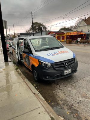 Quickey Locksmith van arriving for a house lockout service at a residential property in Houston, TX