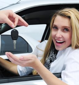 happy woman receiving car key